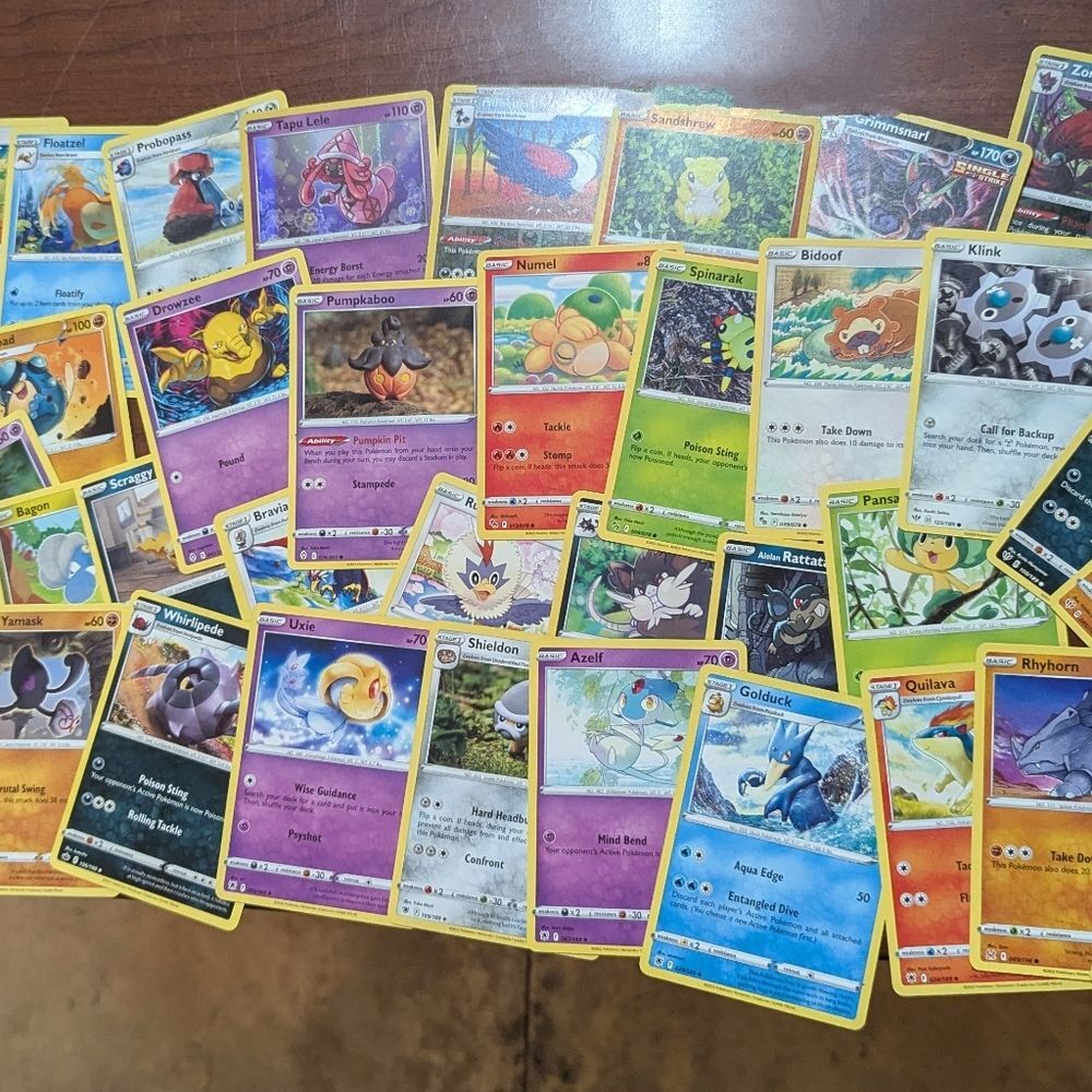 Pokémon Cards Random Lot 50 Cards Bulk Reverse Holo comes in a tin